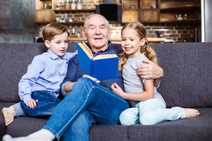 Grandfather reading with kids
